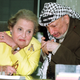US Secretary of State Madeleine Albright meets Palestinian Leader Yasser Arafat while wearing a bee brooch in 1999.
